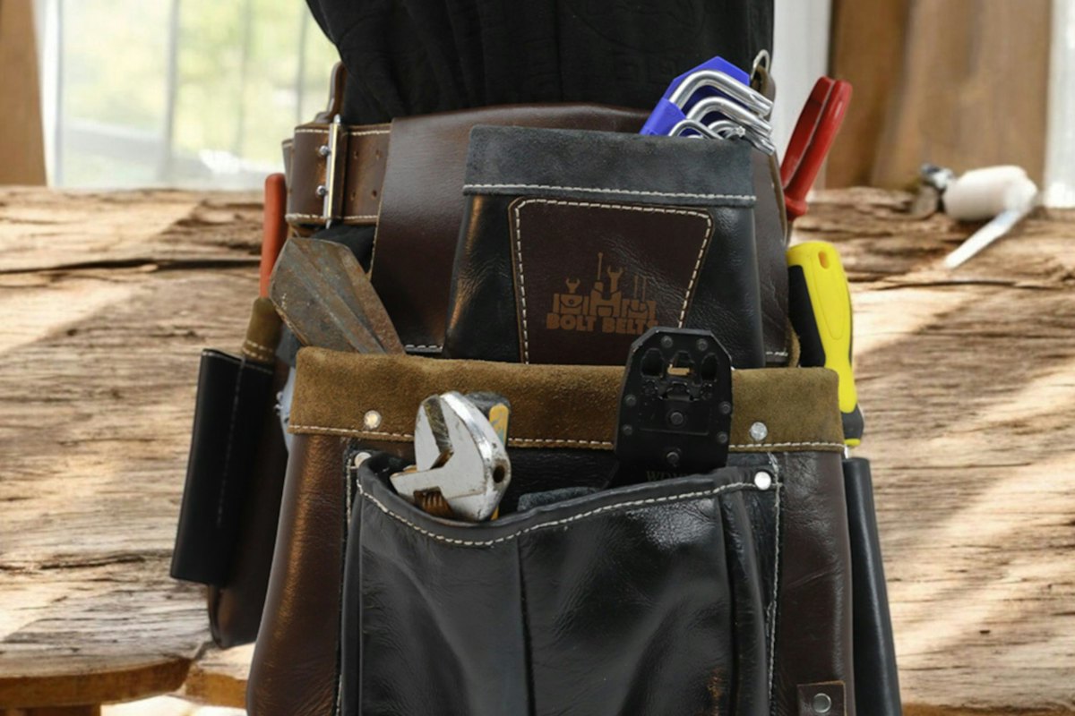 A tool belt filled with hand tools